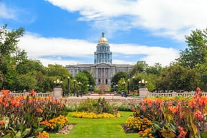 photo of the Denver State Capitol building with the greenery and garden on display