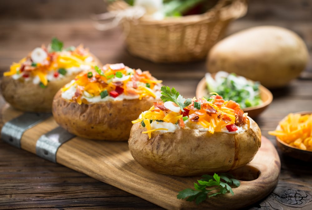 photo of bacon and cheddar potatoes displayed on a cutting board, showing how delicious a cannabis oil crock pot recipe could turn out