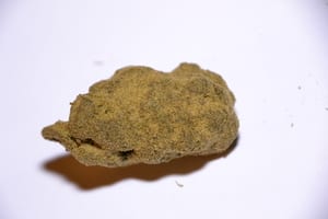 image of a marijuana moon rock with a white background