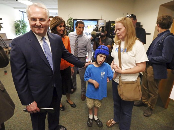 Jack Gerard Jack Gerard, left, a leader in The Church of Jesus Christ of Latter-day Saints, speaks with Heather Nelson and her son Matthew, 10, following a news conference with opponents of Utah's medical marijuana ballot initiative Thursday, Aug. 23, 2018, in Salt Lake City.