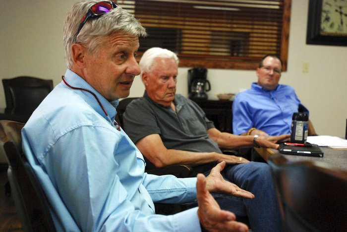 Election 2018-Senate-Johnson Libertarian U.S. Senate candidate Gary Johnson, left, talks on the campaign trail with board members of a bank, in Tucumcari, N.M. Former governor of New Mexico and two-time presidential candidate Johnson says he would act as an influential swing vote and a voice of reason in a bitterly divided Senate.