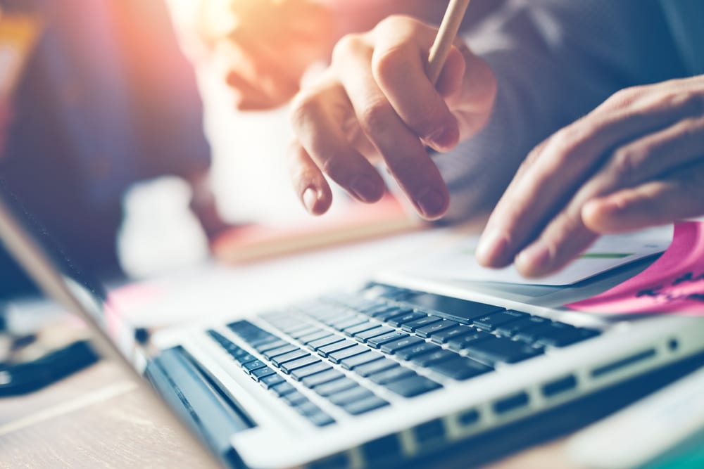 typing a cover letter for cannabis industry on a computer